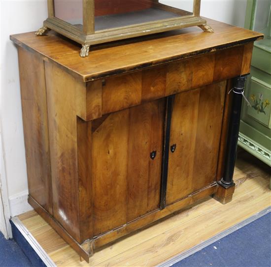 A mid 19th century German fruitwood cupboard, fitted with a frieze drawer over doors W.81cm